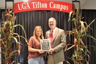 Hannah Mosher (left) was presented with the 2022 Award of Excellence for Student Worker Support by Dr. Michael Toews