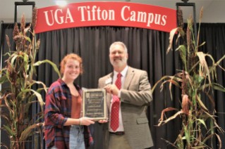 Mallory Marchant (left) was presented with the 2022 Award of Excellence for Student Worker Support by Dr. Michael Toews
